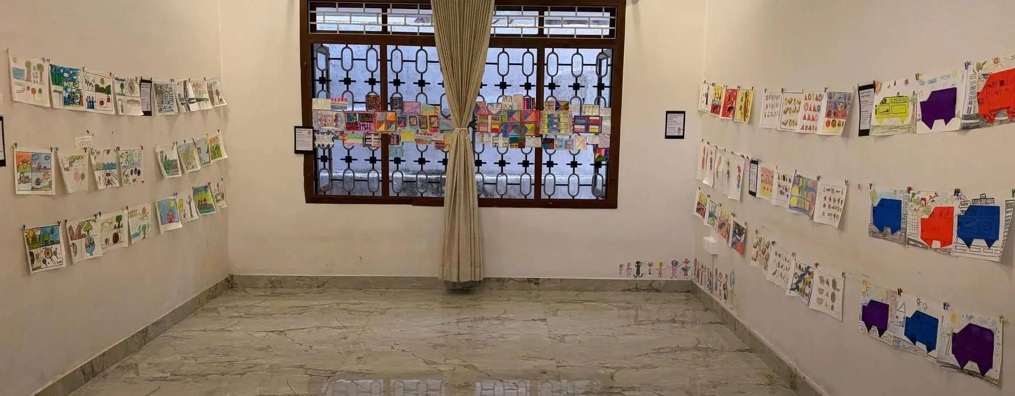 The children's art exhibition filled the walls with colour