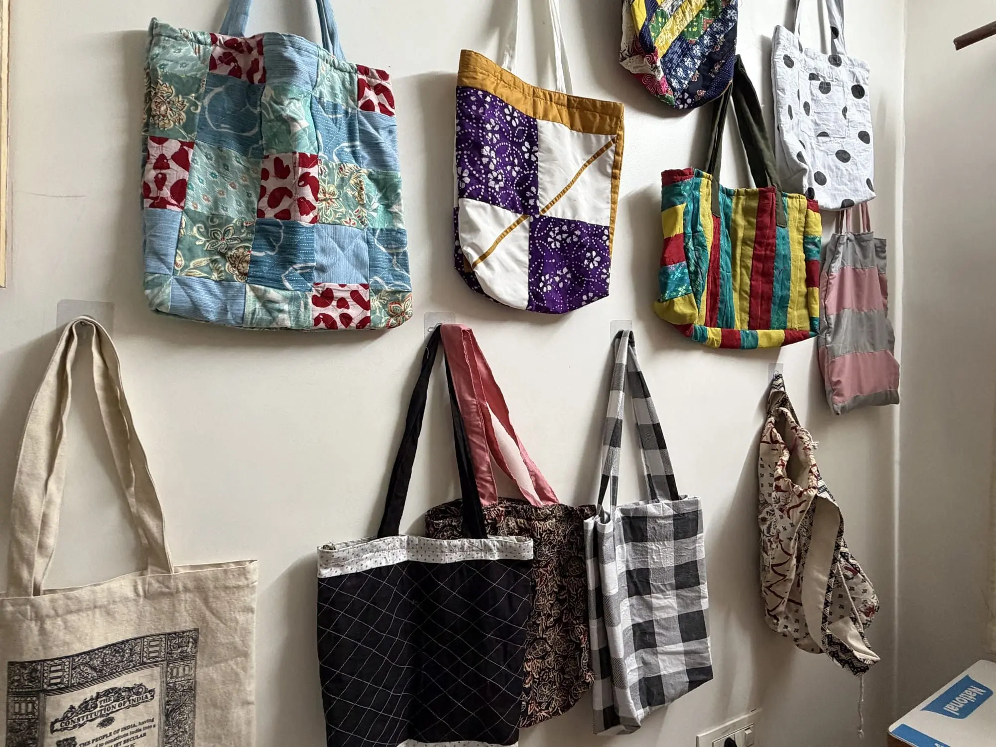 The wall of finished bags shows the class's progress