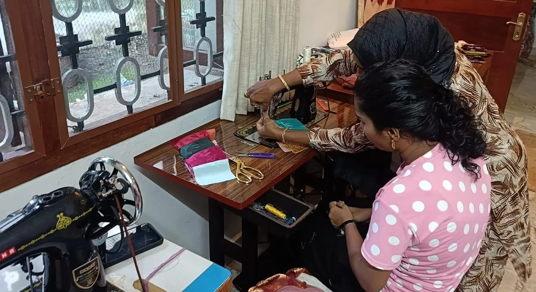 One-to-one coaching on handling the sewing machines