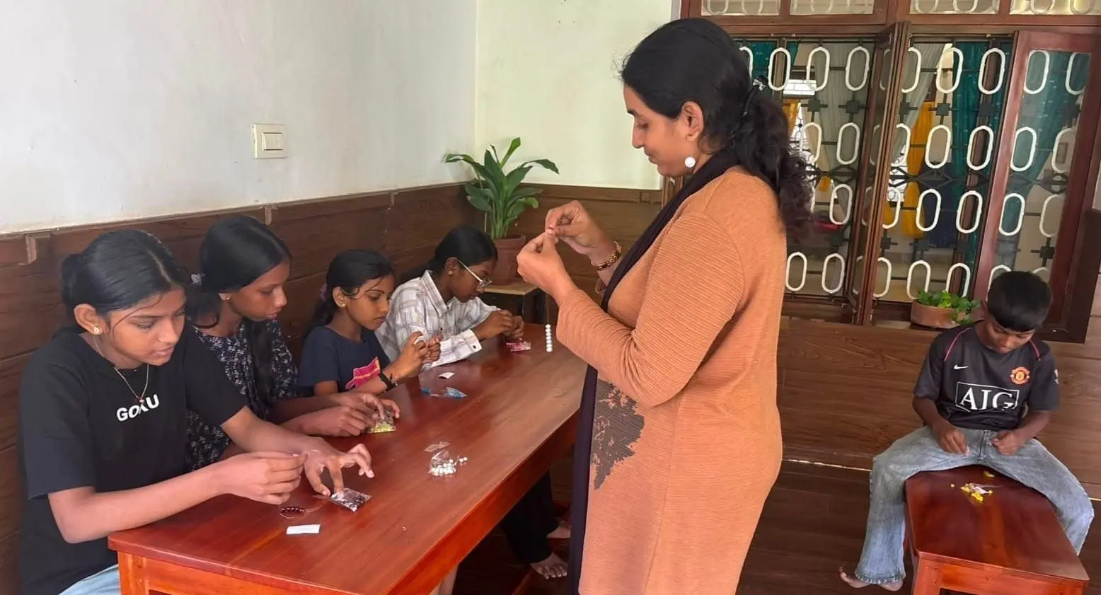 Children learned beading patterns and techniques