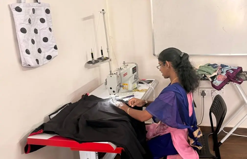 Stitching faculty prepares a new cut-piece bag sample